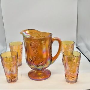 Vintage Carnival glass pitcher and cups